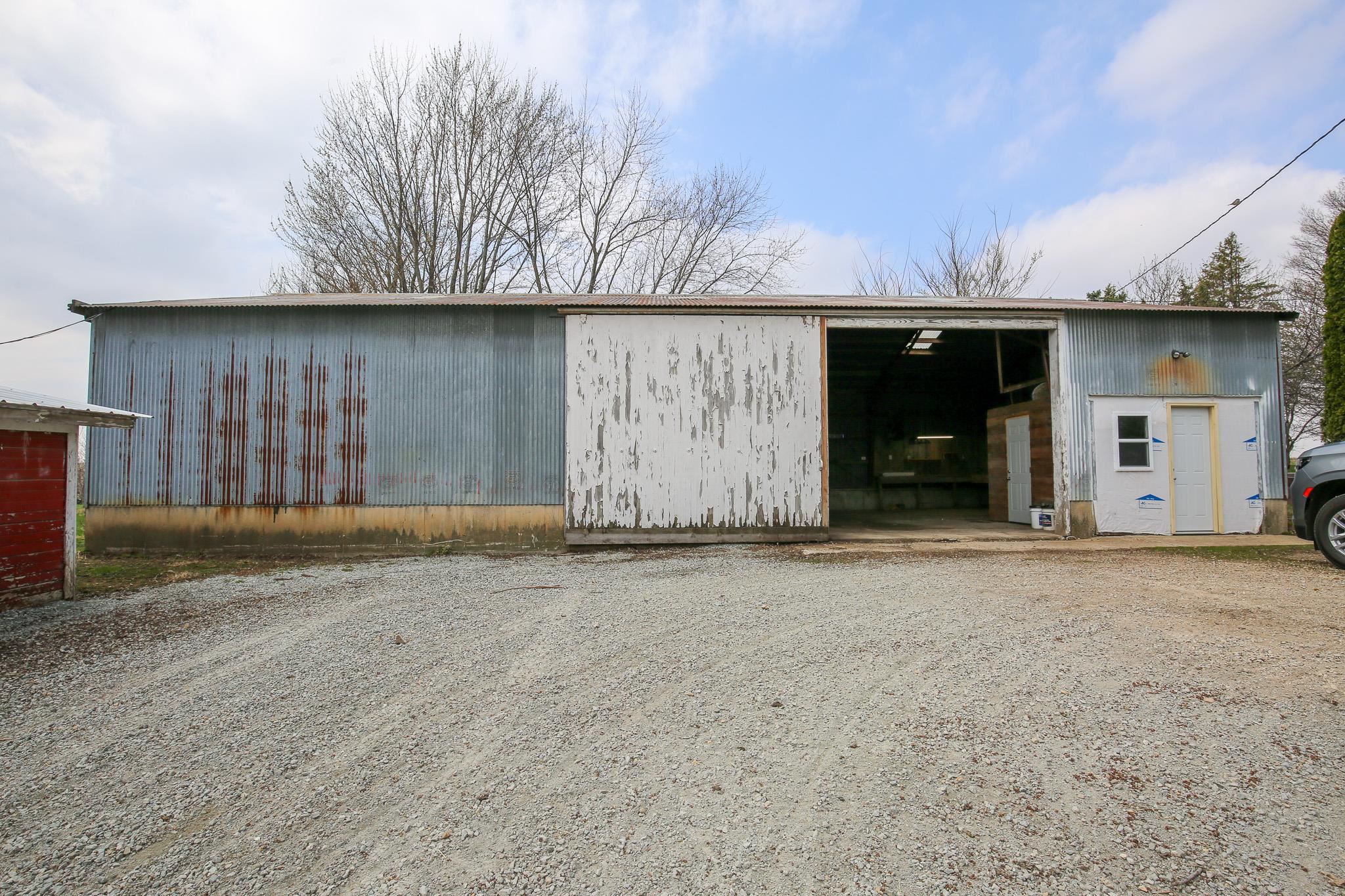 26596 Fairhaven Road Chadwick, IL 61014 - Photo 14 of 51 a view of a house with a garage
