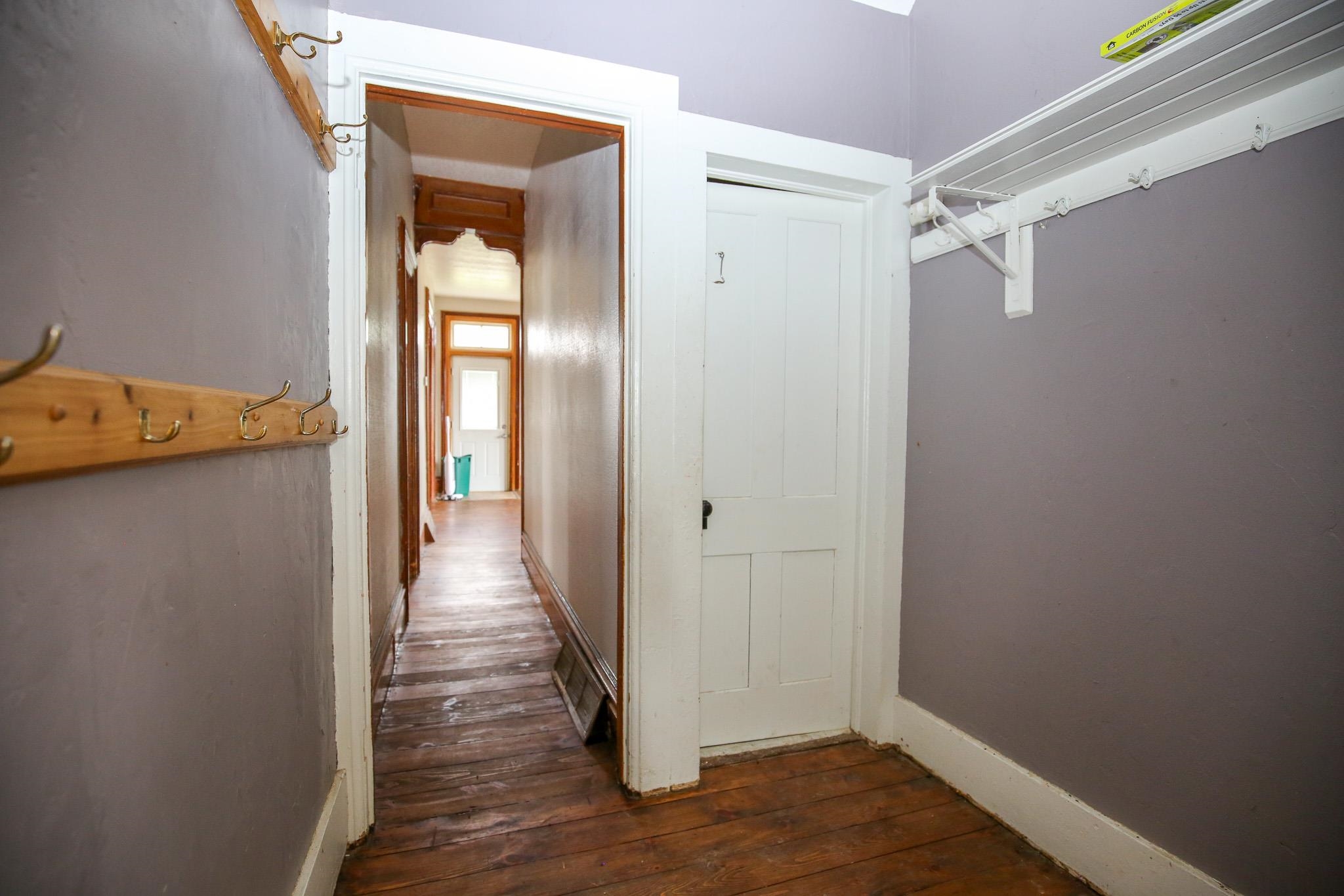 26596 Fairhaven Road Chadwick, IL 61014 - Photo 25 of 51 a view of a hallway with wooden floor and a bathroom