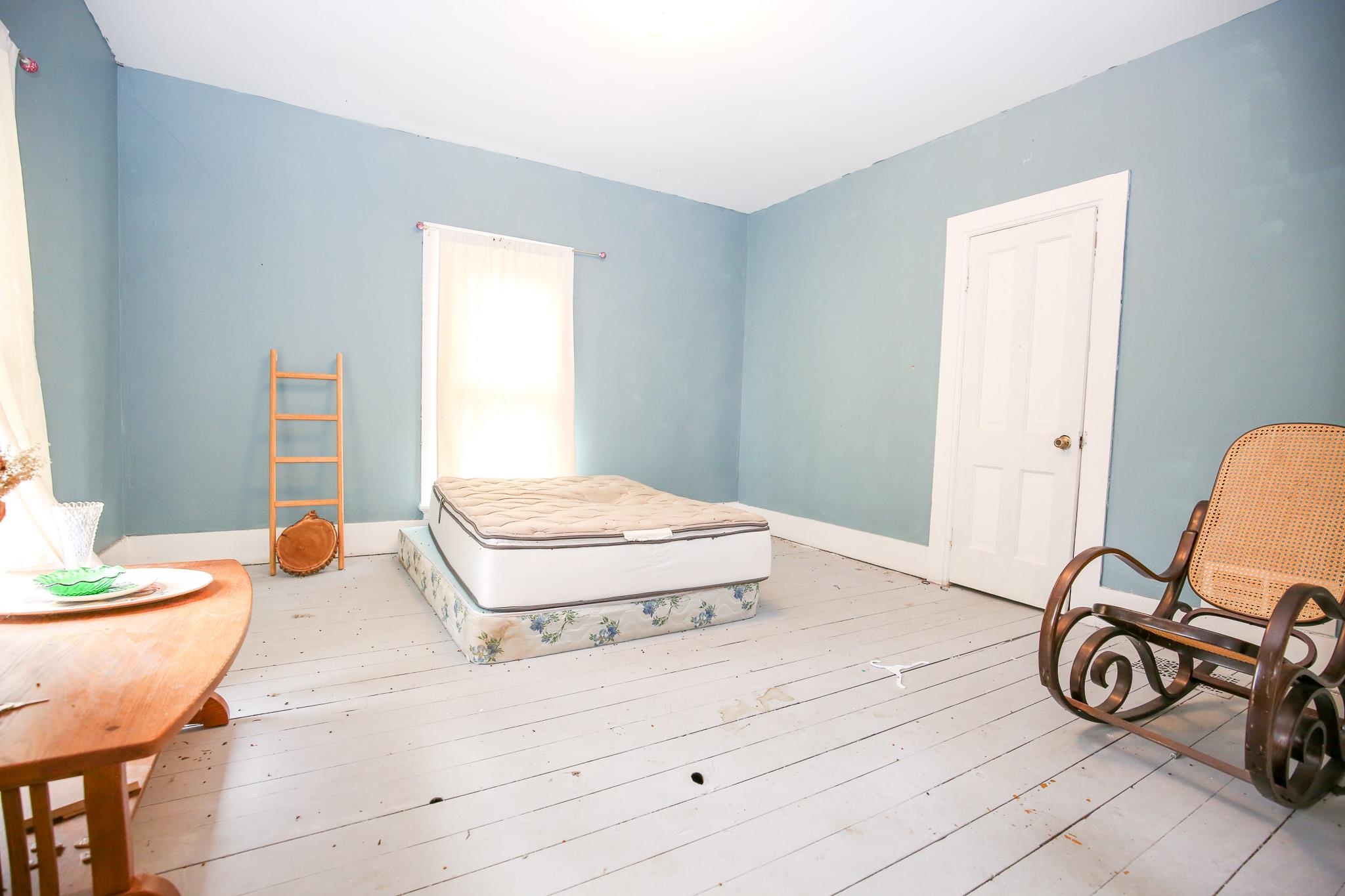 26596 Fairhaven Road Chadwick, IL 61014 - Photo 35 of 51 a bedroom with a bed and a table