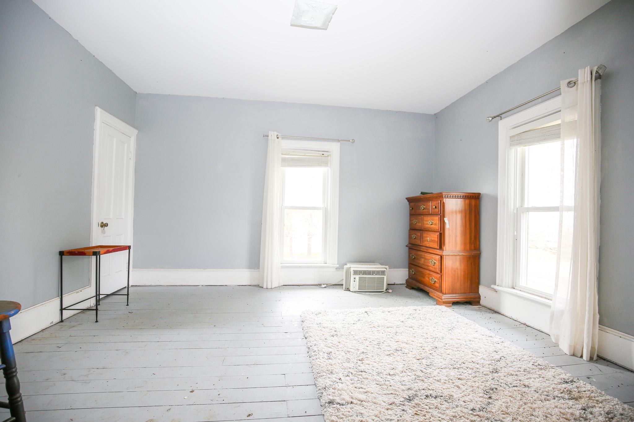 26596 Fairhaven Road Chadwick, IL 61014 - Photo 36 of 51 an empty room with windows and closet