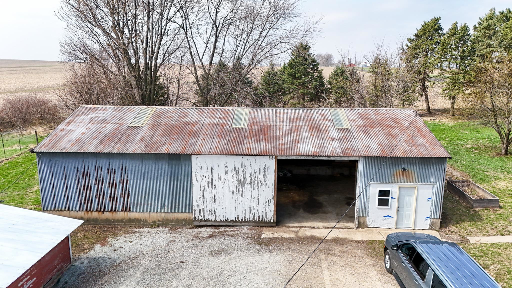 26596 Fairhaven Road Chadwick, IL 61014 - Photo 48 of 51 a front view of a house with garden