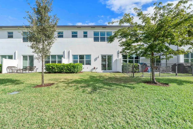 a view of a house with a back yard