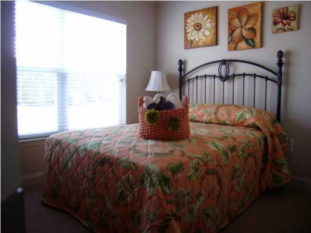 28 South Sand Palm Road, Unit 46 Freeport, FL 32439 - Photo 11 of 19 a bed sitting in a bedroom next to a window