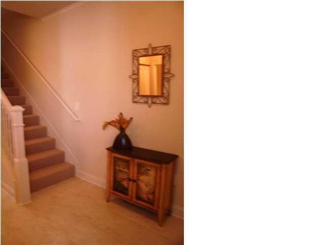 28 South Sand Palm Road, Unit 46 Freeport, FL 32439 - Photo 13 of 19 a living room with furniture and a potted plant