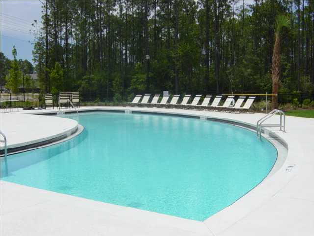 28 South Sand Palm Road, Unit 46 Freeport, FL 32439 - Photo 15 of 19 a view of a swimming pool with a lawn chairs