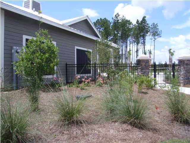 28 South Sand Palm Road, Unit 46 Freeport, FL 32439 - Photo 17 of 19 a view of a house with a patio