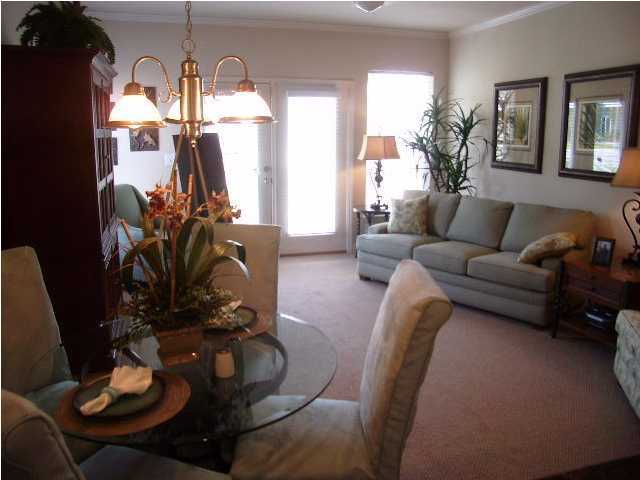 28 South Sand Palm Road, Unit 46 Freeport, FL 32439 - Photo 4 of 19 a living room with furniture and wooden floor