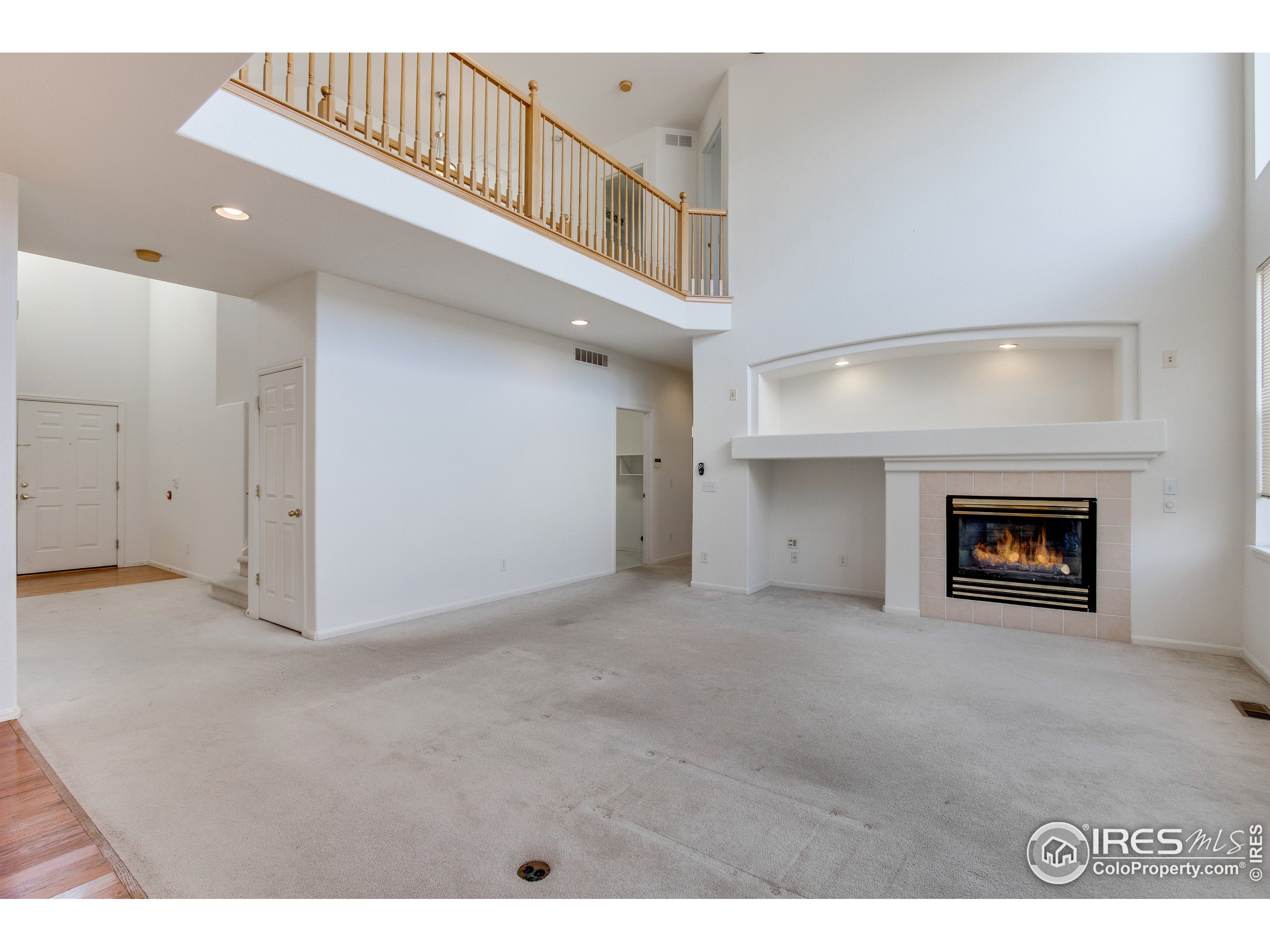 6808 Silverleaf Avenue Firestone, CO 80504 - Photo 12 of 40 a view interior of a house with an entryway and fireplace