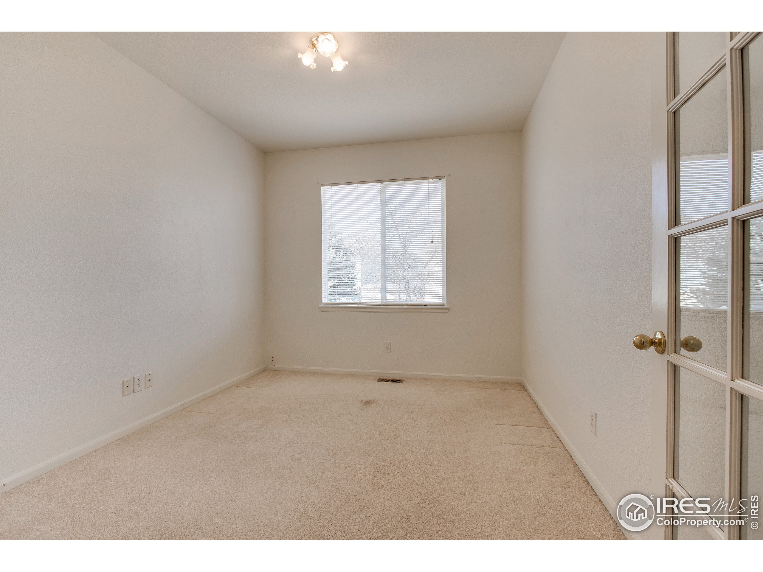 6808 Silverleaf Avenue Firestone, CO 80504 - Photo 13 of 40 an empty room with windows