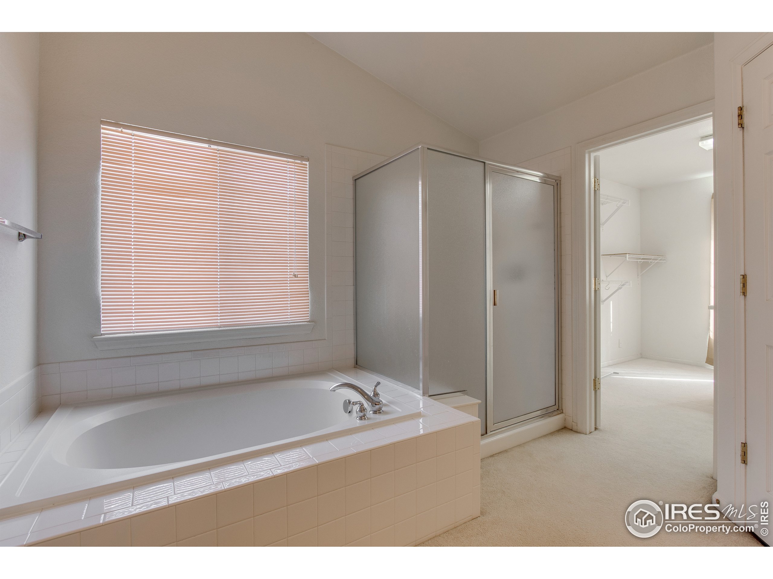 6808 Silverleaf Avenue Firestone, CO 80504 - Photo 21 of 40 a bathroom with a bathtub and a shower