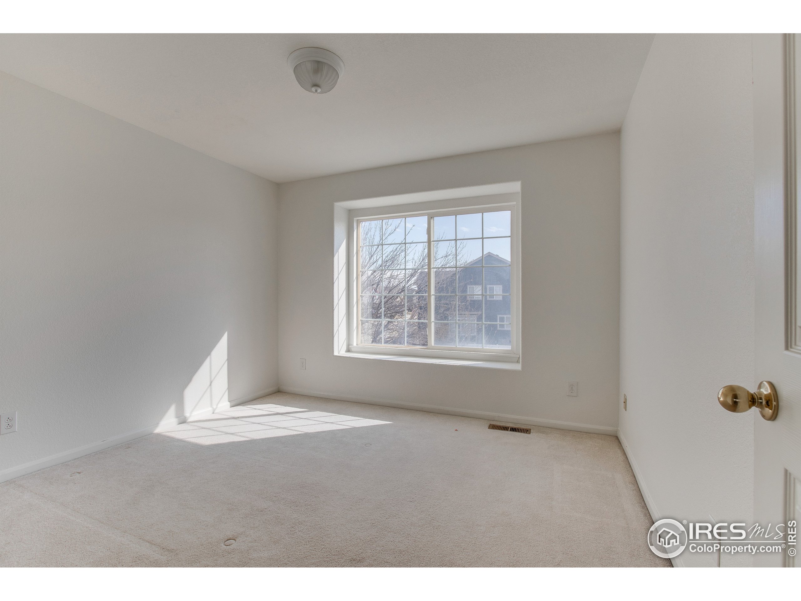 6808 Silverleaf Avenue Firestone, CO 80504 - Photo 26 of 40 a view of an empty room with a window