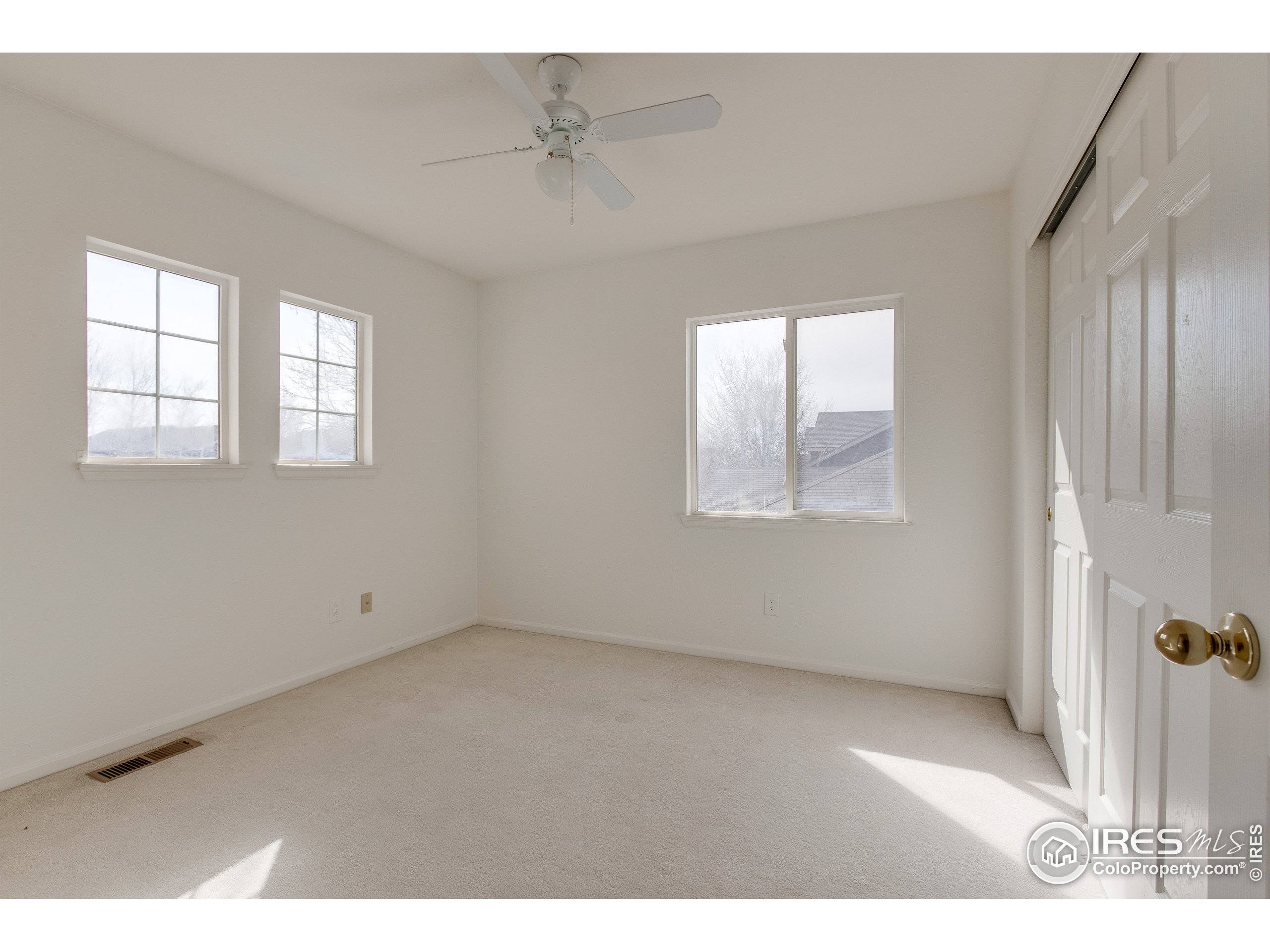 6808 Silverleaf Avenue Firestone, CO 80504 - Photo 27 of 40 an empty room with windows