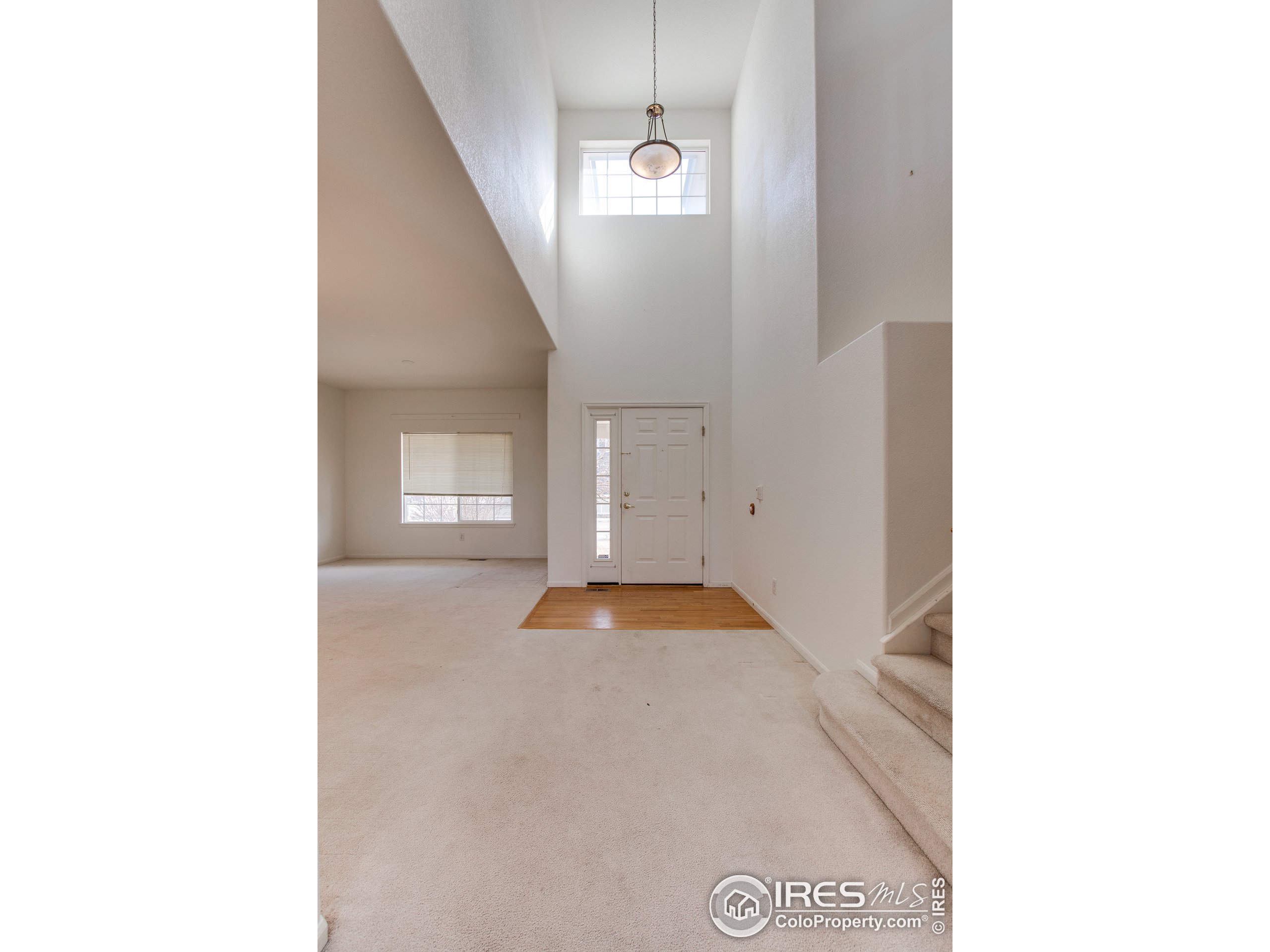 6808 Silverleaf Avenue Firestone, CO 80504 - Photo 4 of 40 a view of an empty room with windows