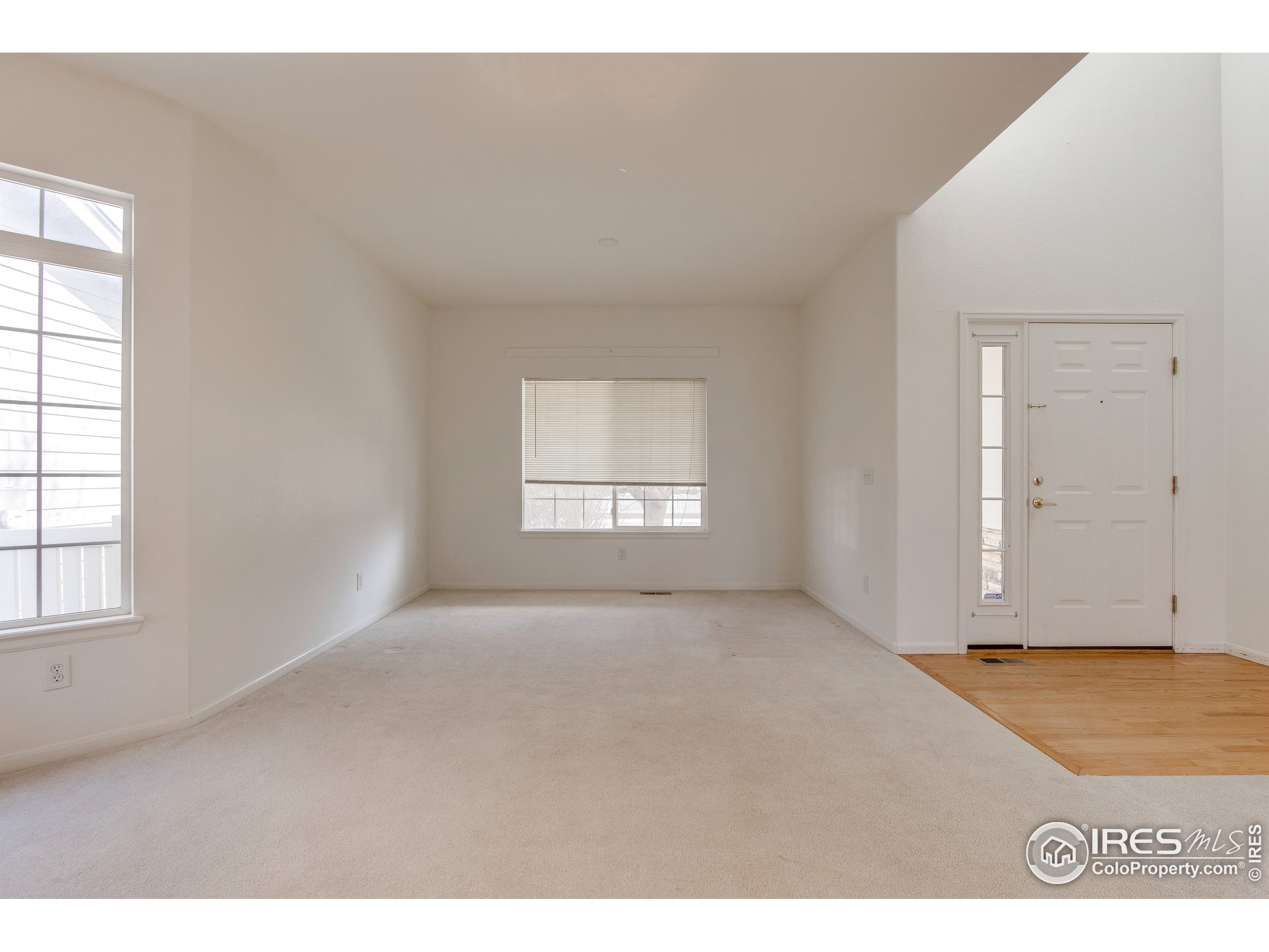 6808 Silverleaf Avenue Firestone, CO 80504 - Photo 5 of 40 an empty room with windows