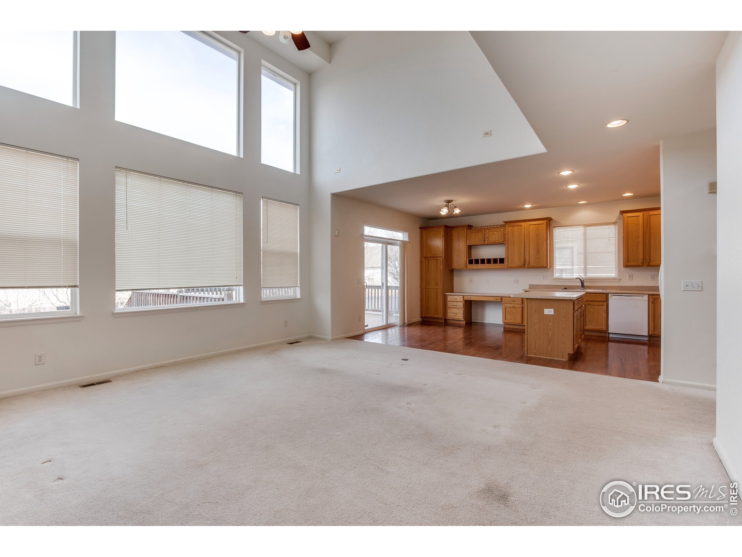 6808 Silverleaf Avenue Firestone, CO 80504 - Photo 10 of 40 a view of an empty room with a kitchen