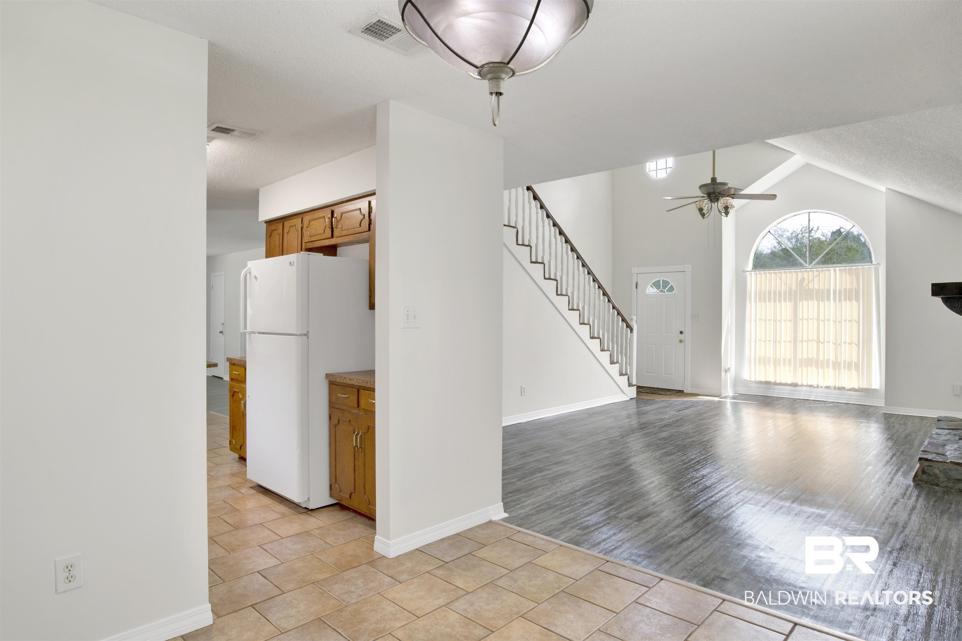5480 Country Club Boulevard Theodore, AL 36582 - Photo 7 of 36 Interior space featuring lofted ceiling, ceiling fan, and light hardwood / wood-style floors