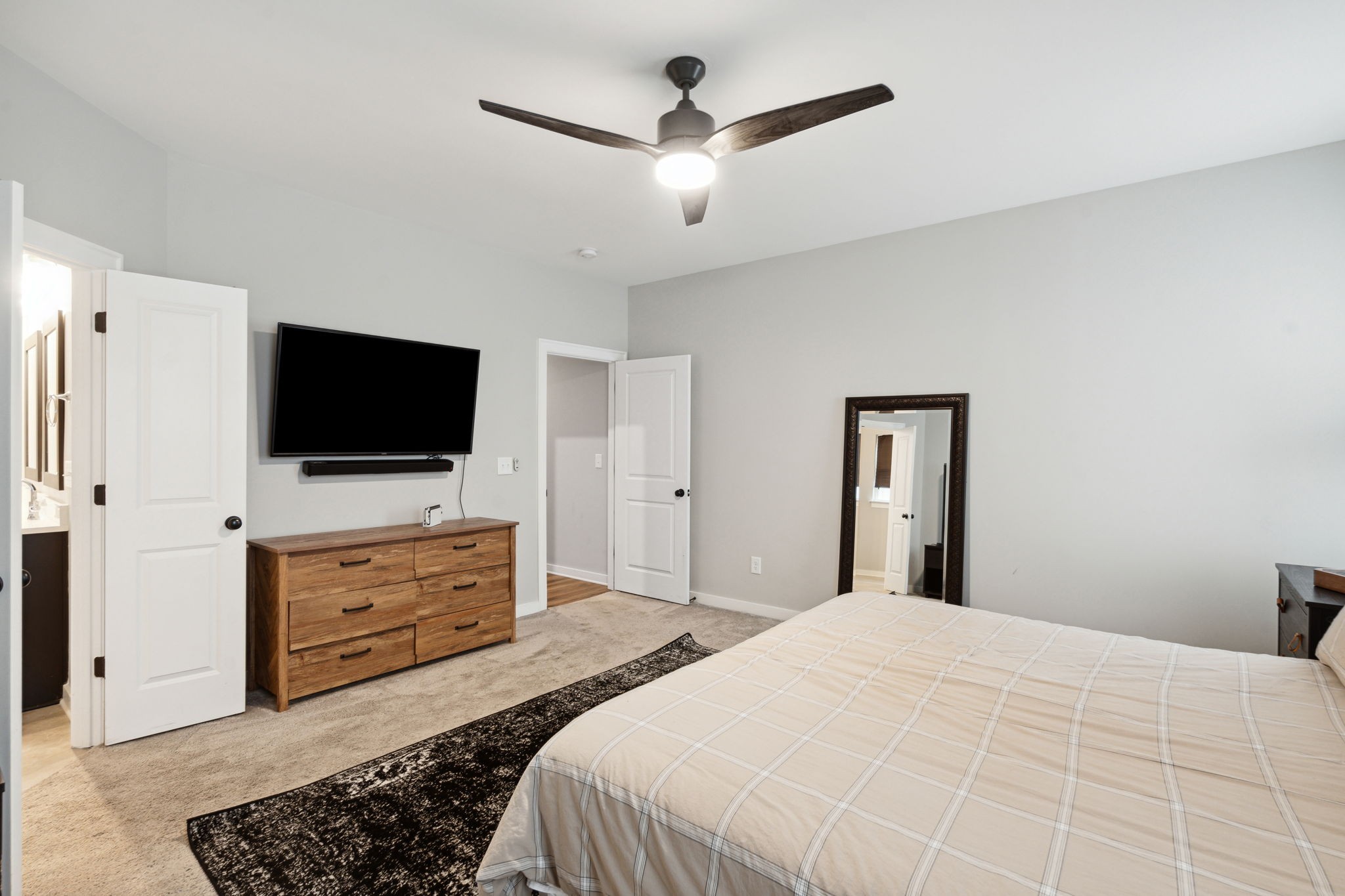 847 Plowson Road Mount Juliet, TN 37122 - Photo 20 of 56 a bedroom with a bed a flat screen tv and dresser