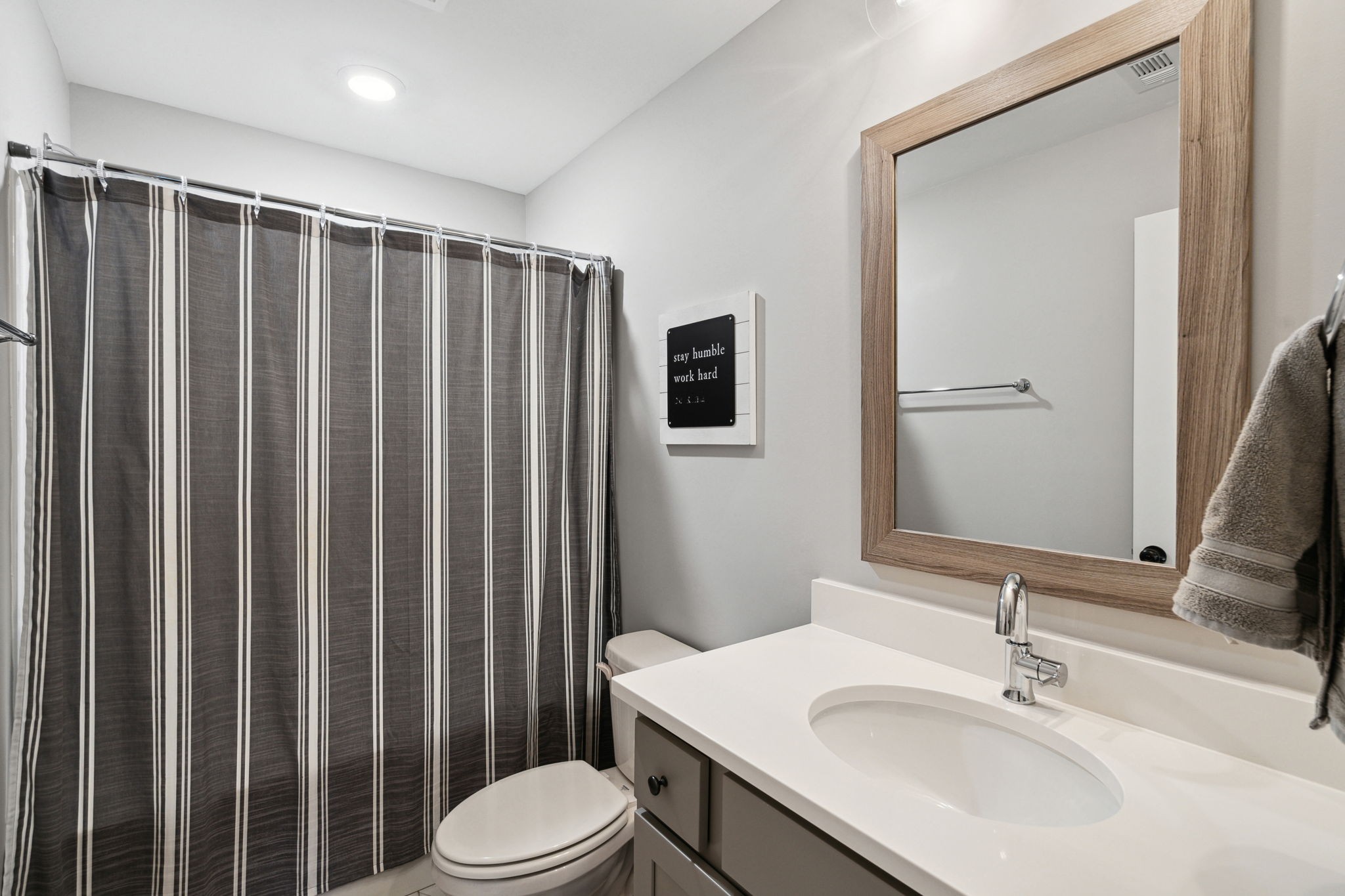 847 Plowson Road Mount Juliet, TN 37122 - Photo 28 of 56 a bathroom with a sink a toilet and shower curtain