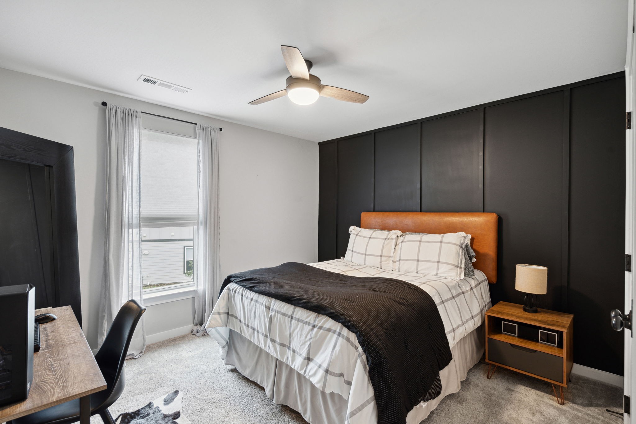 847 Plowson Road Mount Juliet, TN 37122 - Photo 29 of 56 a bedroom with a bed and a chandelier