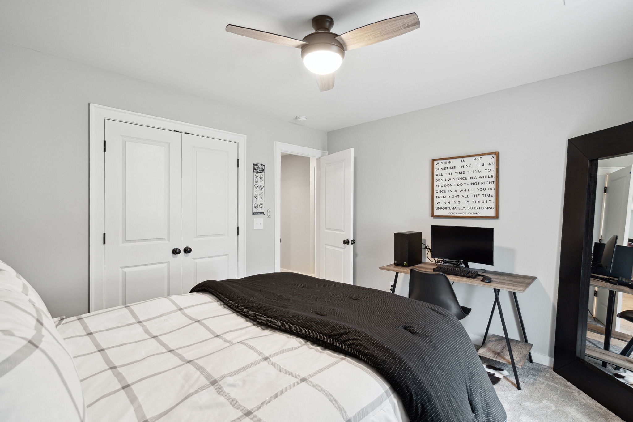 847 Plowson Road Mount Juliet, TN 37122 - Photo 30 of 56 a bedroom with a bed and a flat screen tv