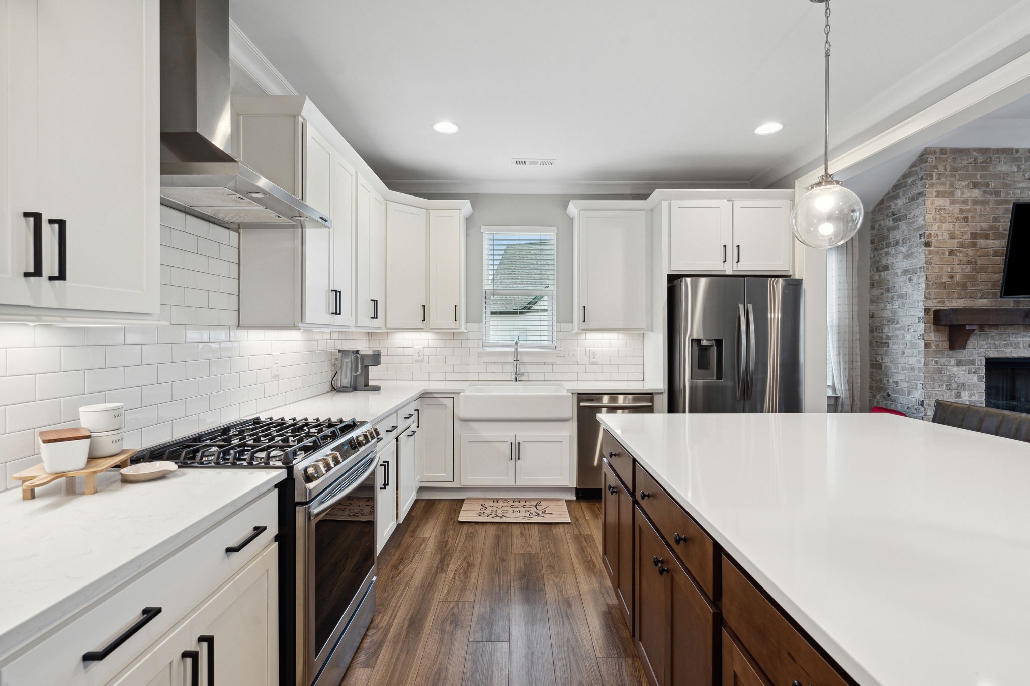 847 Plowson Road Mount Juliet, TN 37122 - Photo 6 of 56 a kitchen with white cabinets and stainless steel appliances