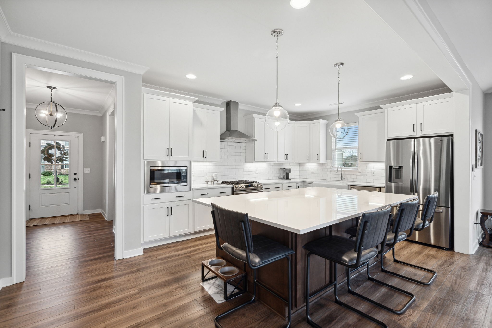 847 Plowson Road Mount Juliet, TN 37122 - Photo 7 of 56 a large kitchen with a table and chairs