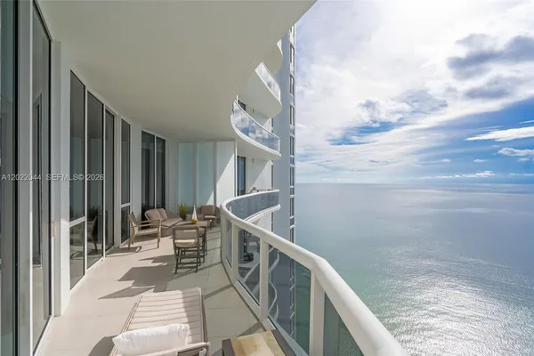 a balcony with view of nearby houses