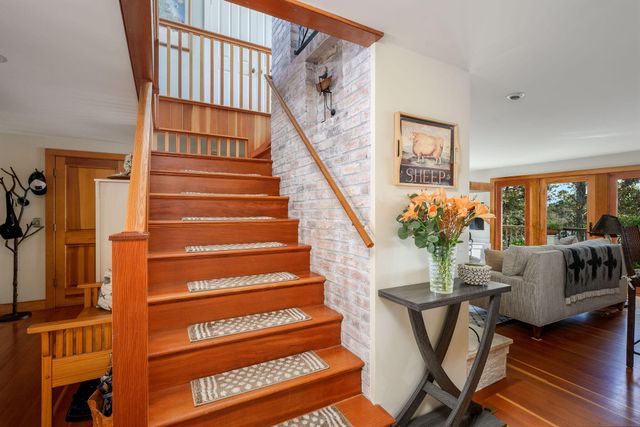 a brick building with a clock on the wall