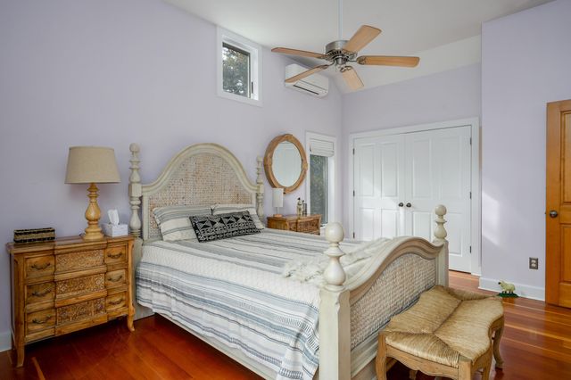 a view of entryway with wooden floor and stairs