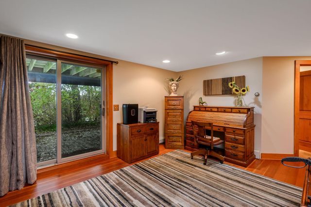 a bathroom with a toilet a sink and a mirror
