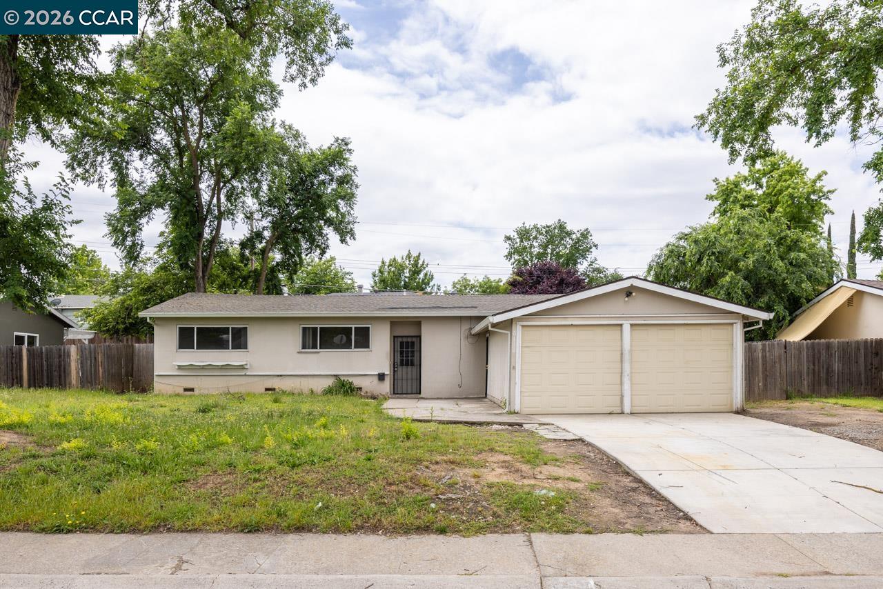 6118 Rutland Drive Carmichael, CA 95608 - Photo 1 of 19 a front view of a house with garden