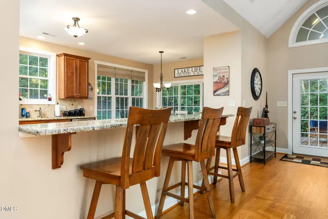 a view of balcony with wooden floor and seating space