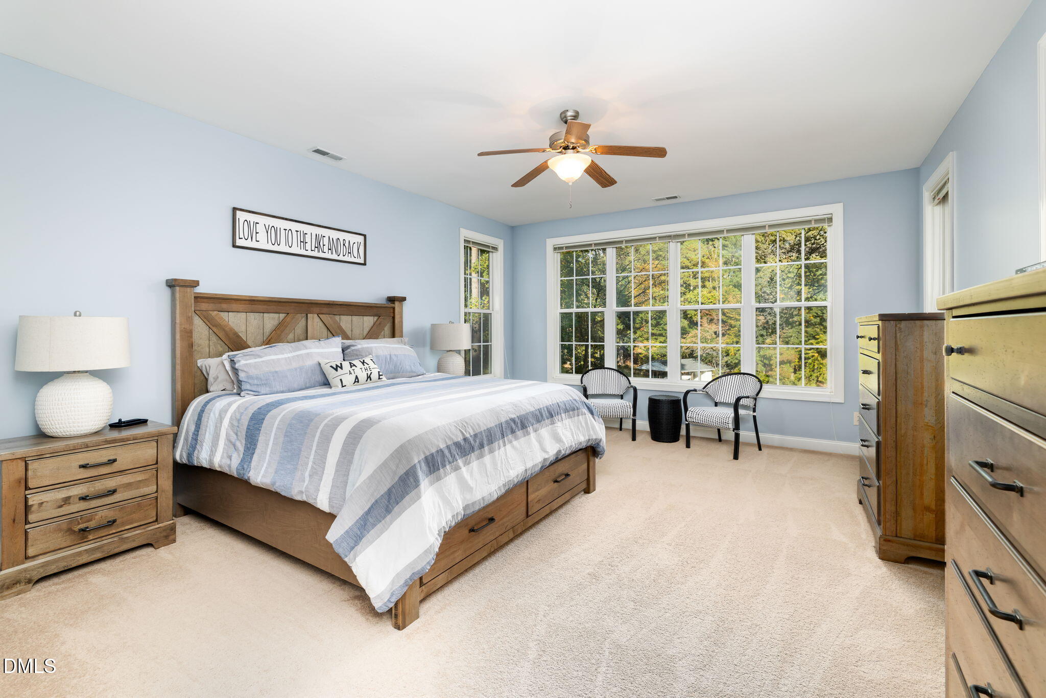 140 Breezewood Road Boydton, VA 23917 - Photo 30 of 87 a spacious bedroom with a bed and a chandelier