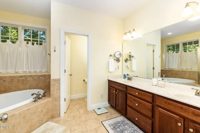 a bathroom with a sink a toilet and shower curtain