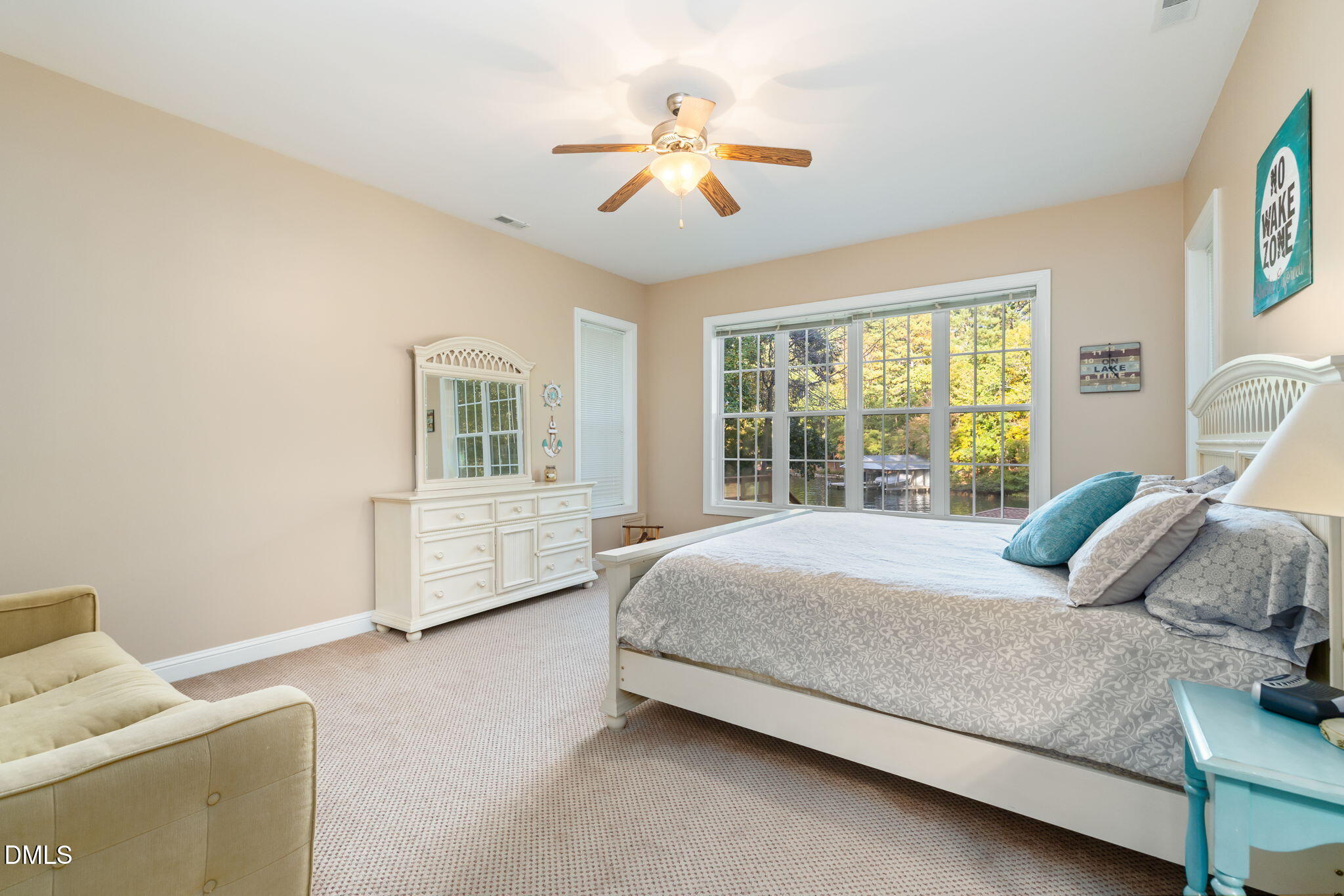140 Breezewood Road Boydton, VA 23917 - Photo 56 of 87 a bedroom with a bed a couch and a chandelier