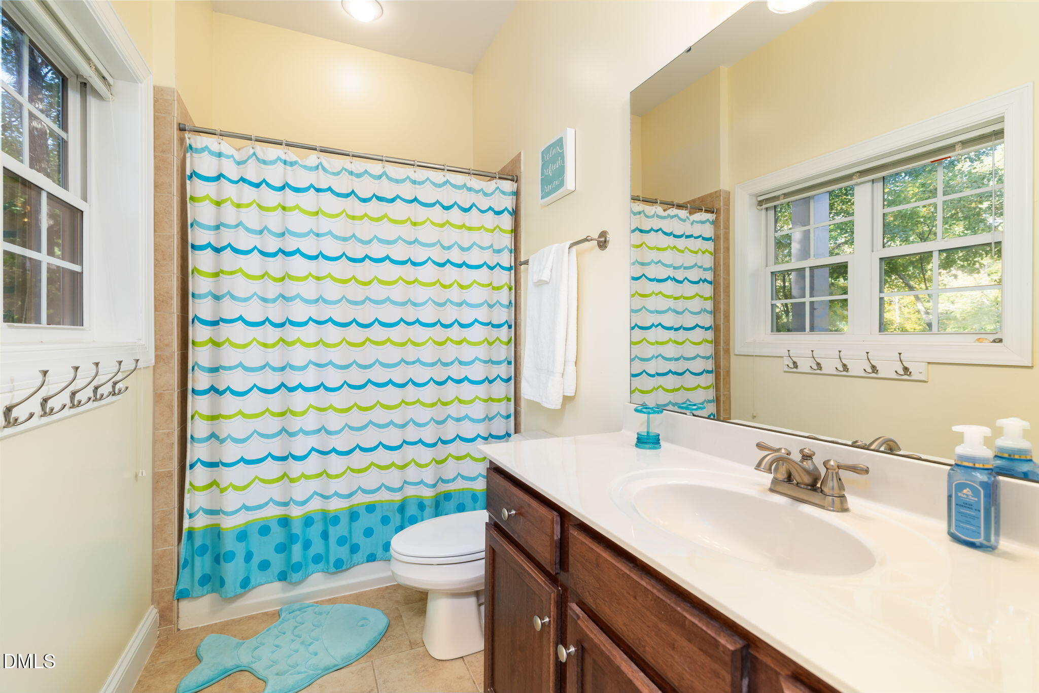 140 Breezewood Road Boydton, VA 23917 - Photo 59 of 87 a bathroom with a sink a toilet and shower curtain