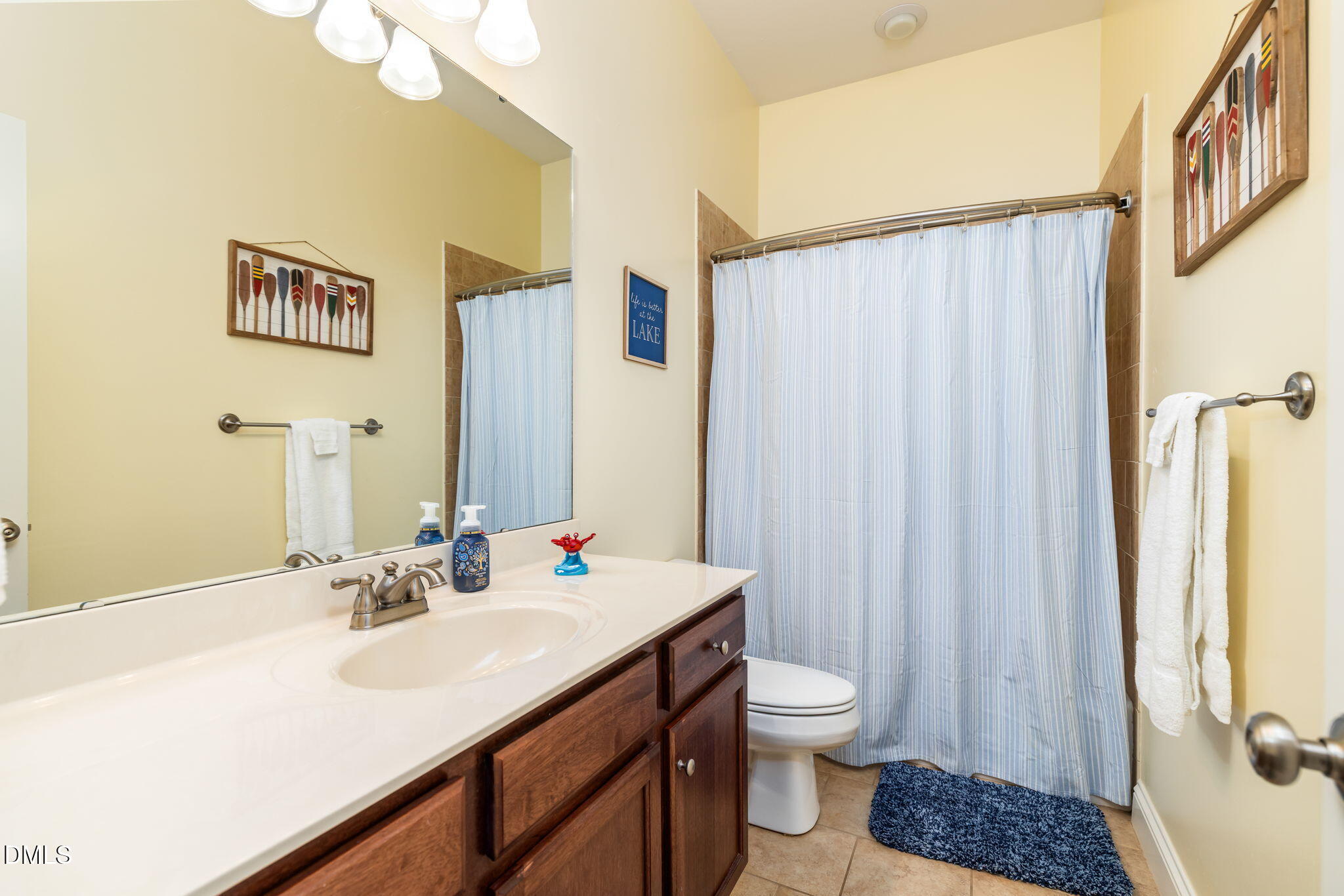 140 Breezewood Road Boydton, VA 23917 - Photo 60 of 87 a bathroom with a sink a toilet and shower curtain