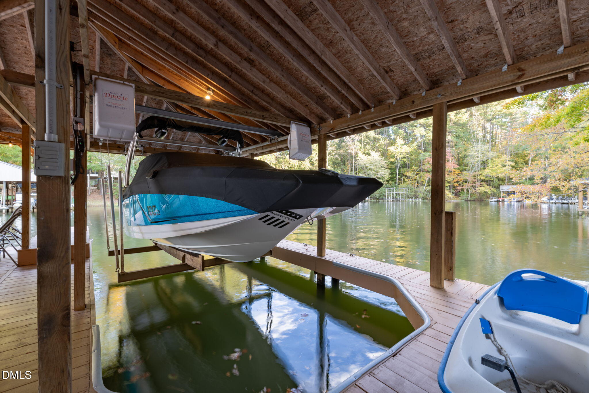 140 Breezewood Road Boydton, VA 23917 - Photo 76 of 87 a roof deck with table and chairs under an umbrella with a wooden floor