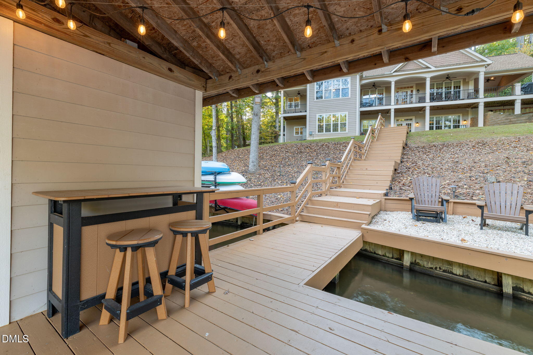 140 Breezewood Road Boydton, VA 23917 - Photo 77 of 87 a view of a deck with table and chairs with wooden floor and fence