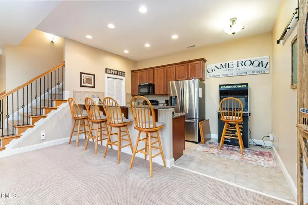a living room with furniture ceiling fan and a rug