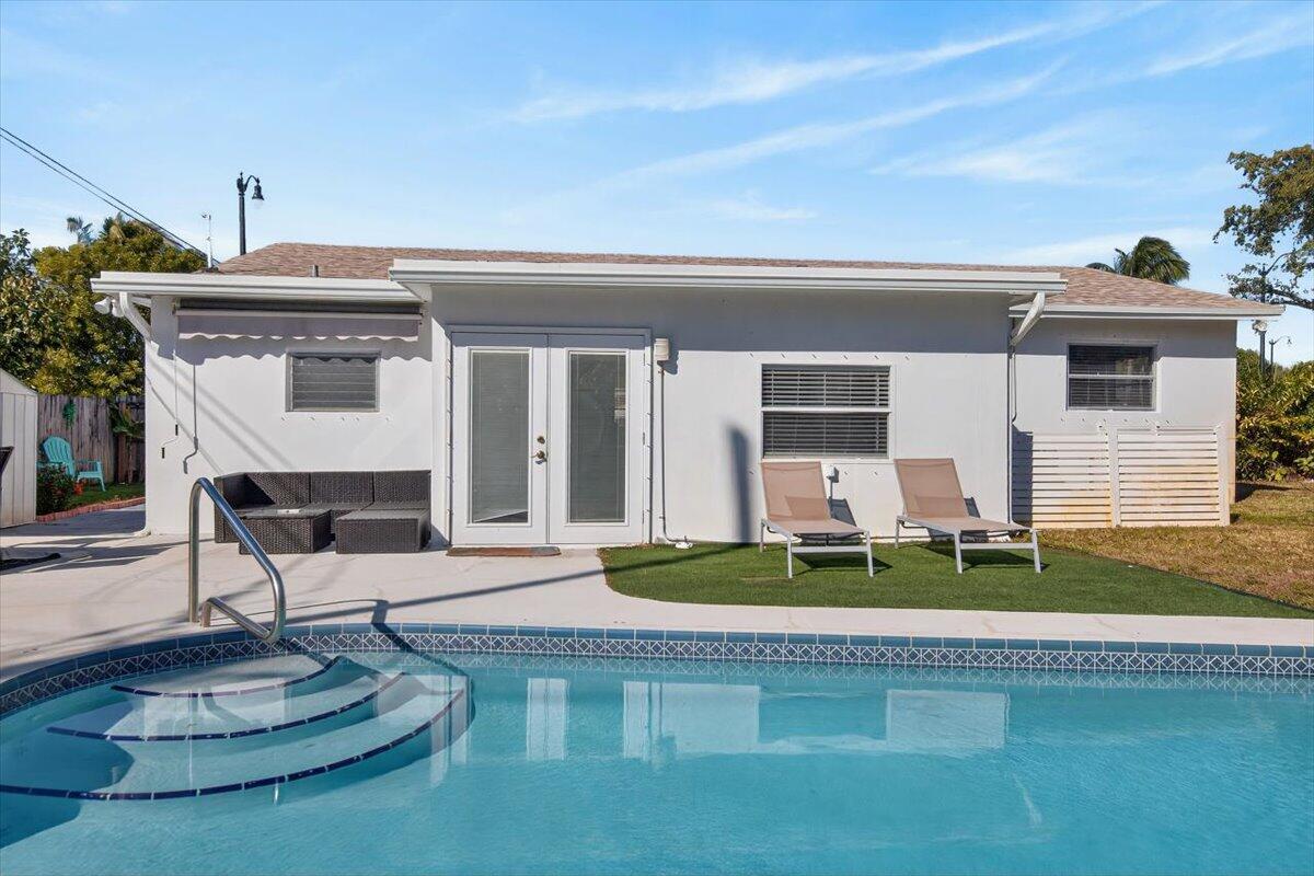 110 Northeast 30th Street Pompano Beach, FL 33064 - Photo 30 of 31 a front view of a house with a porch