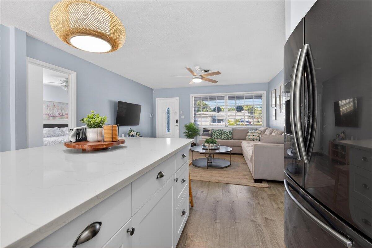 110 Northeast 30th Street Pompano Beach, FL 33064 - Photo 9 of 31 a living room with furniture and a large window