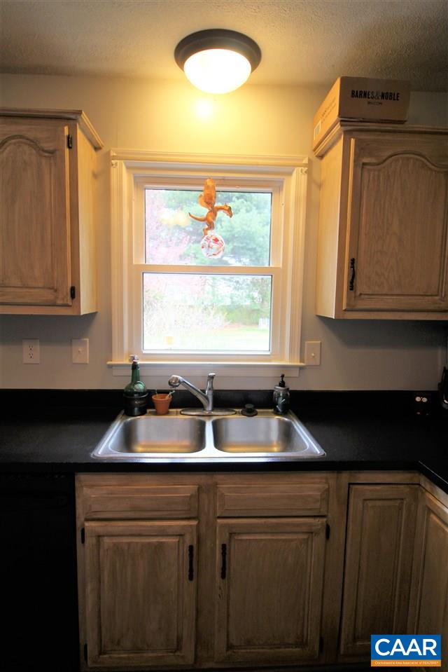 896 Cedar Grove Road Ruckersville, VA 22968 - Photo 12 of 31 a kitchen with granite countertop a sink and a window