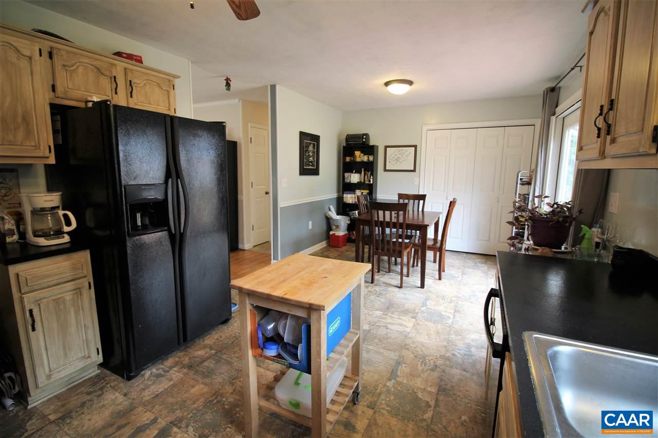 896 Cedar Grove Road Ruckersville, VA 22968 - Photo 13 of 31 a kitchen with stainless steel appliances granite countertop a refrigerator and a stove top oven