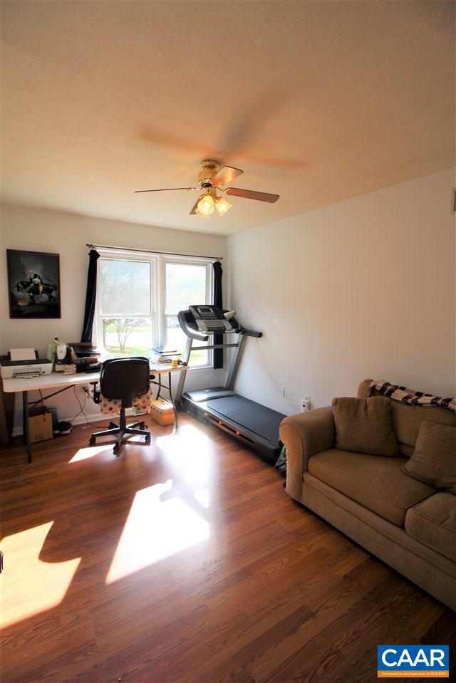 896 Cedar Grove Road Ruckersville, VA 22968 - Photo 16 of 31 a living room with furniture and a flat screen tv