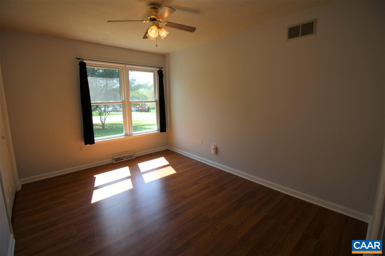 896 Cedar Grove Road Ruckersville, VA 22968 - Photo 17 of 31 a view of empty room with wooden floor and fan