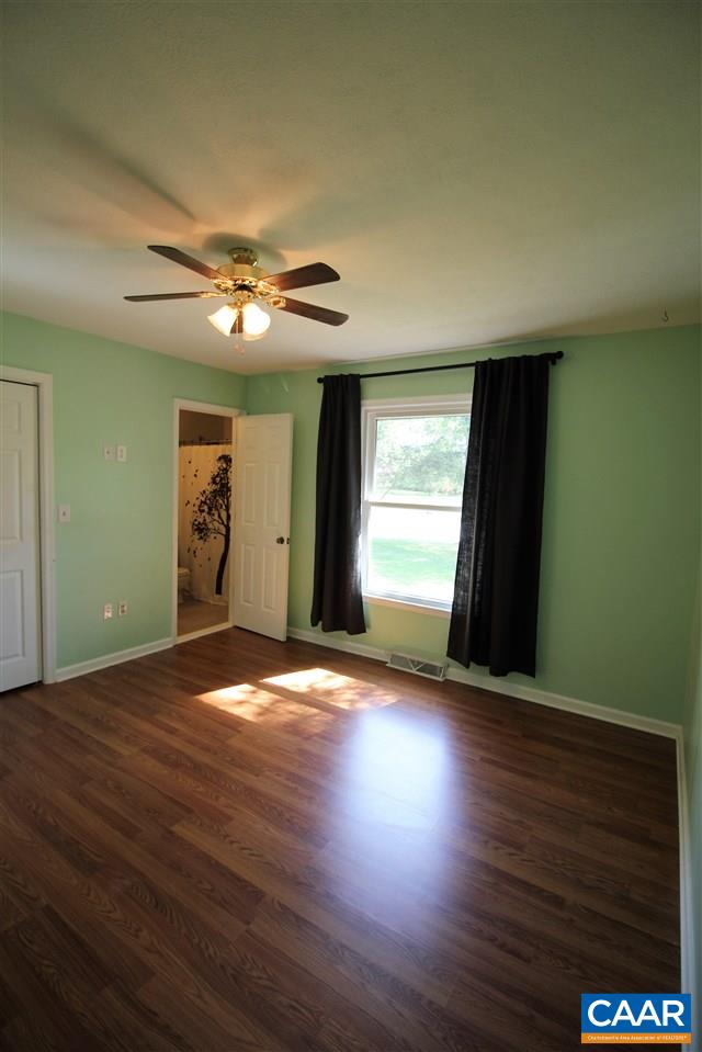 896 Cedar Grove Road Ruckersville, VA 22968 - Photo 23 of 31 an empty room with wooden floor and windows