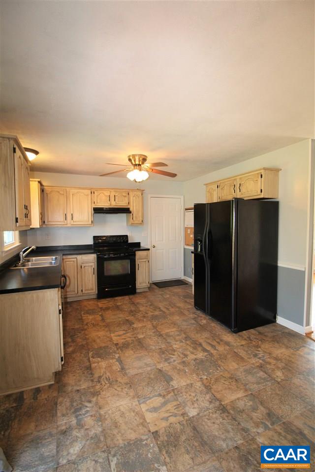 896 Cedar Grove Road Ruckersville, VA 22968 - Photo 9 of 31 a kitchen with a refrigerator and a sink