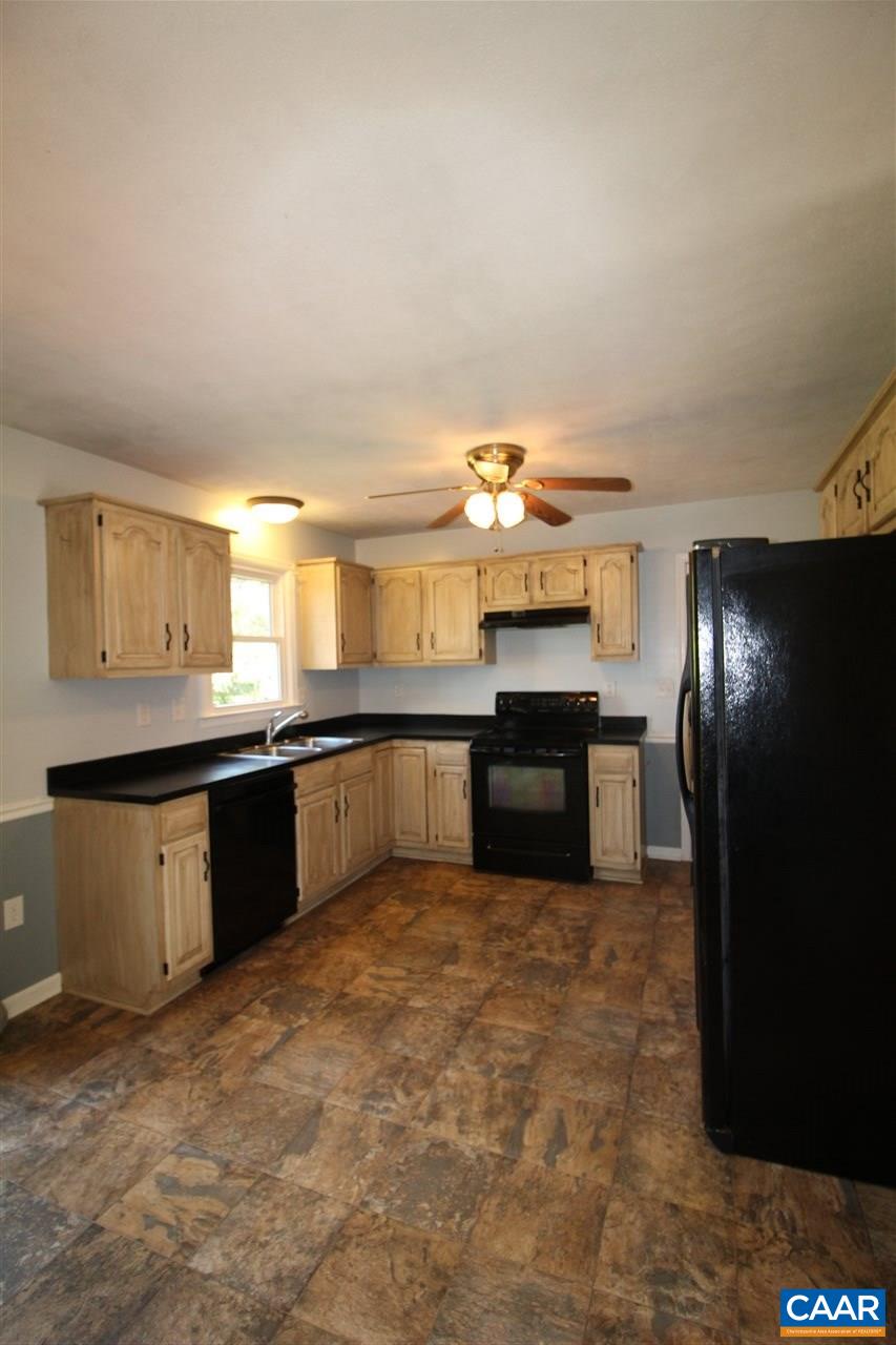 896 Cedar Grove Road Ruckersville, VA 22968 - Photo 10 of 31 a large kitchen with a stove a refrigerator and a sink