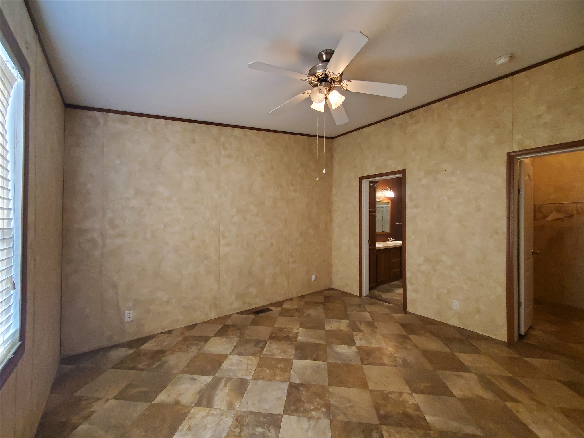 61 County Road 433 Taylor, TX 76574 - Photo 13 of 18 a view of an empty room with a chandelier fan
